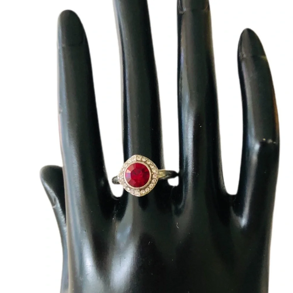 Brighton ruby ring with crystals around the ring. Excellent condition. Size 7.